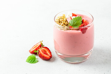 Healthy strawberry oatmeal granola yogurt dessert in glasses. Copy space, flat lay.