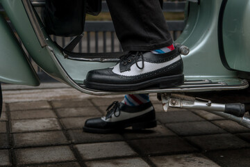 These hand-made black-and-white wingtip shoes with loafers sole made from genuine leather are being...