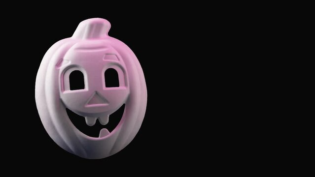 Halloween, melon in the form of a ghost, changes color to red, on a black background, Halloween concept video animation 4K