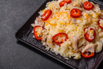 Homemade chinese fried rice with vegetables and a chicken