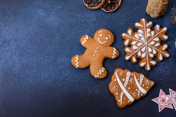Christmas decorations and gingerbreads on a dark concrete table
