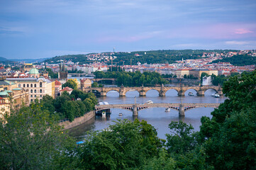Fototapeta na wymiar Famous bridges over Vltava River in the city of Prague in the evening