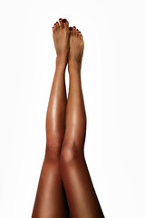 Beautiful smooth woman's legs after laser hair removal on the white background. Treatment,...