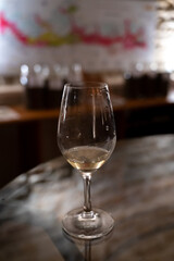 Wine tasting in underground cellars caves of French wine domain in Puligny-Motrachet village, Burgundy, France