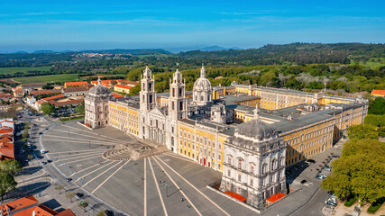 Obraz na płótnie Canvas Aerial view of the Palace of Mafra. Unesco world heritage in Portugal. Aerial top view of the Royal Convent and Palace of Mafra, baroque and neoclassical palace. Drone view of a historic castle.