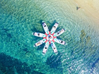 Beautiful aerial view of SUP (stand up paddleboard) yoga in the Mediterranean Sea, Croatia.
