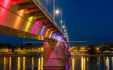 Fototapeta na wymiar View of the beautiful bridge on the Danube at night with colored lights Novi Sad