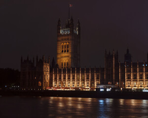 Fototapeta premium Palace of Westminster at night. Reflections on the river. The meeting place for houses of the Parliament of the United Kingdom. London, England.
