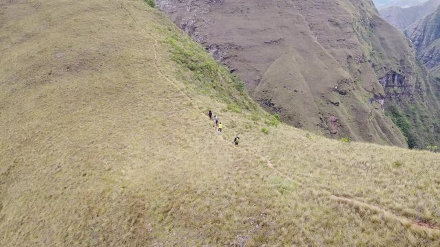Group of young people hiking in the mountains near Samaipata Bolivia - CODO DE LOS ANDES - SANTA CRUZ BOLIVIA