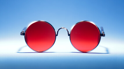 Vintage round sunglasses in red. Old fashioned, retro style.
