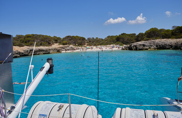 Menorca, Spain: Beautiful bay with sailing boat catamaran