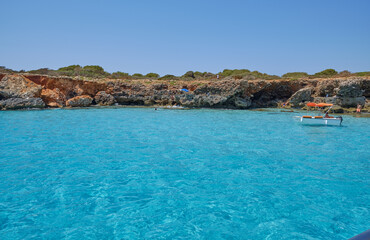Obraz na płótnie Canvas Menorca, Spain: Beautiful bay with sailing boat catamaran