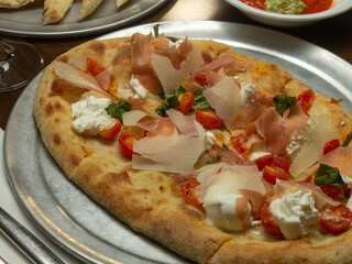 traditional pizza with tomatoes and mozzarella