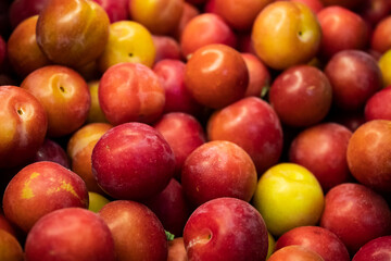 plums in a market