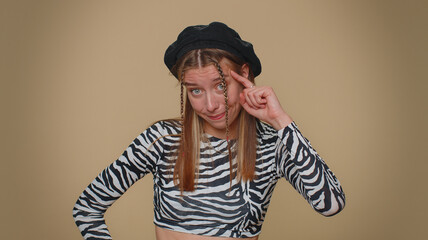 You are crazy, out of mind. Lovely pretty young woman pointing at camera and showing stupid...