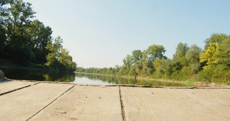 Old riverboat sailing on a river course on a sunny day in the summer season.