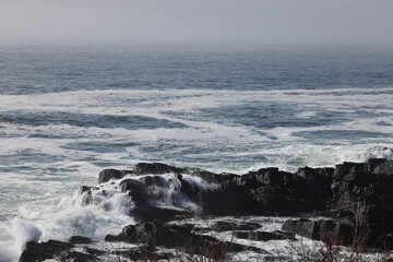 Ocean waves meeting a rocky shore