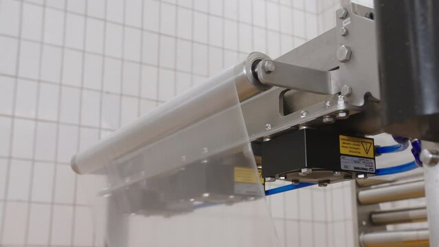 Feeding rolled food grade polyethylene into packaging machine