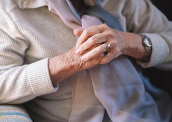 Obraz na płótnie Canvas Elderly woman hands clasped retirement concept
