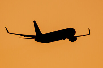 Boeing 767 departing King County Airport into the Sunset - obrazy, fototapety, plakaty