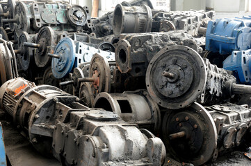 Abandoned and old equipment stacked in factory warehouses