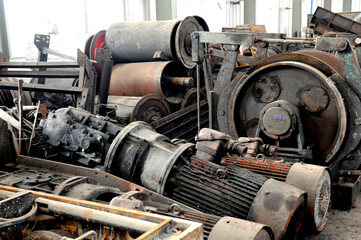 Abandoned and old equipment stacked in factory warehouses