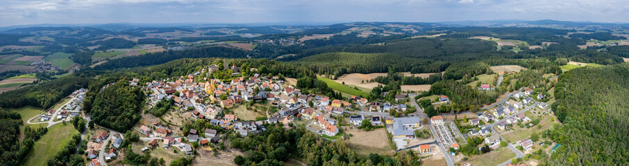 Fototapeta na wymiar Aerial view of the village Leuchtenberg in Germany, Bavaria on a sunny day in summer.
