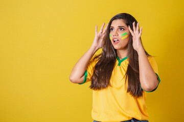 Woman supporter of Brazil, world cup 2022, football championship, anxious, attentive while watching...