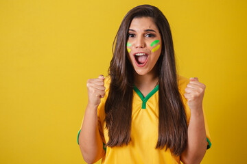 Woman supporter of Brazil, 2022 world cup, football championship, screaming goal, celebrating team...