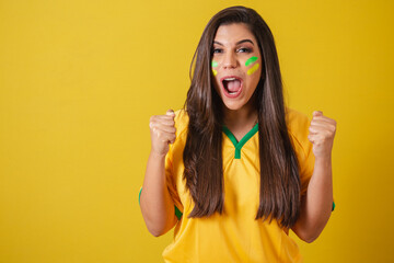 Woman supporter of Brazil, 2022 world cup, football championship, screaming goal, celebrating team...