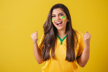 Woman supporter of Brazil, 2022 world cup, football championship, screaming goal, celebrating team...
