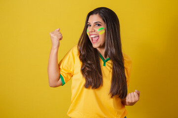 Woman supporter of Brazil, world cup 2022, soccer championship, celebrating for victory, happy and...