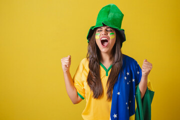 Woman supporter of Brazil, world cup 2022, screaming goal! celebrating, partying amazing!