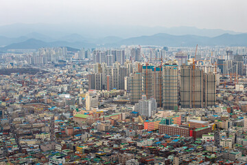 Daegu South Korea city skyline buildings from Duryu Park on a cloudy winter day	
