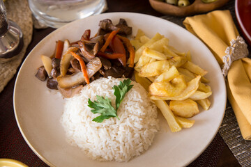 Lomo saltado sauted meat french fries gourmet comfort restaurant food