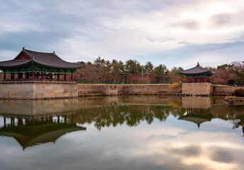 Fototapeta premium Traditional Korean pagoda temple reflection at Wonji Pond in Gyeonju South Korea during sunset