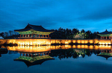 Naklejka premium Traditional Korean pagoda temple reflection at Wonji Pond in Gyeonju South Korea during blue hour night