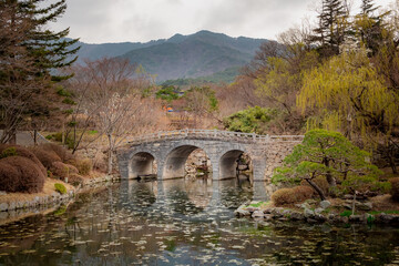 Fototapeta na wymiar Stone bridge mountain fall forest trees view at Bulguksa Buddhist temple in Gyeongju South Korea.