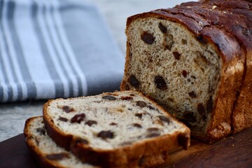 sliced cinnamon raisin bread on a board