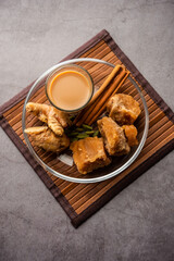 Jaggery tea or Gur ki chai with ingredients like gud, ginger or adrak, green cardamom and cinnamon