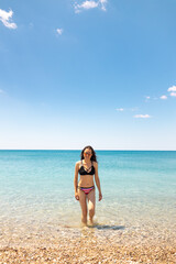 The girl is sunbathing on the beach