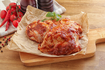 Marinated chicken leg in tomato sauce