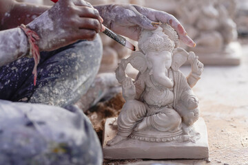 Fototapeta na wymiar Statue of Lord Ganesha Made from plaster of Paris without color.