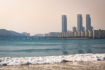 Naklejka premium Tall buildings along the beach and shoreline in Busan South Korea