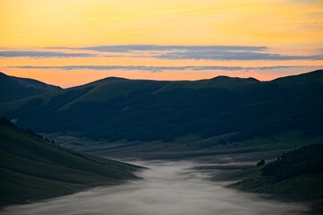 Fog Filled Valley in the Mountains of Italy at Sunrise