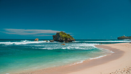 Beautiful beach with white sand and piles of coral in Gunung Kidul, Indonesia, an exotic beach that is still natural and rarely known by tourists