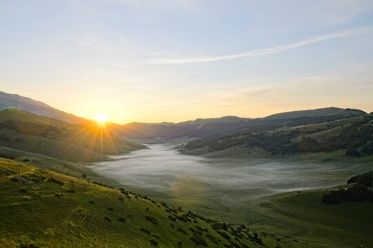 Fog Filled Valley in the Mountains of Italy at Sunrise