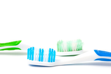 Used and new toothbrushes shot side by side for comparison.