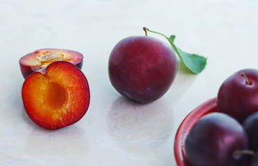 halved red plums