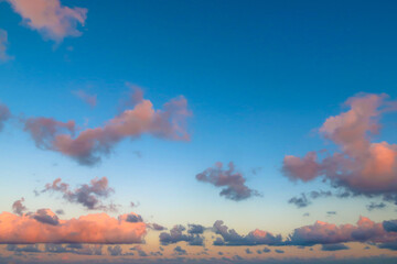 Beautiful sunset sky with orange and blue clouds floating, with no buildings on Ishigaki island,...